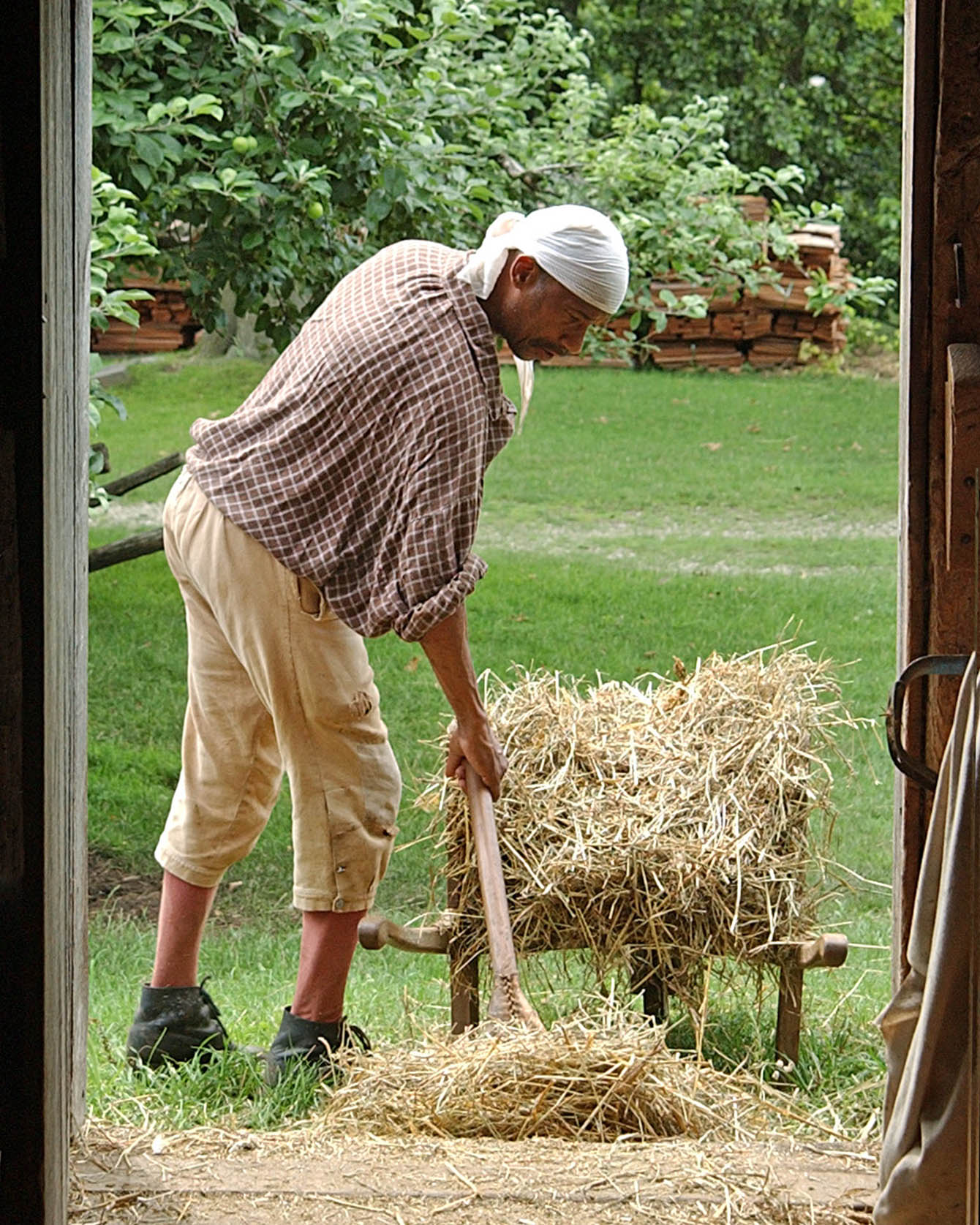 An interpreter works the farm at Philipsburg Manor