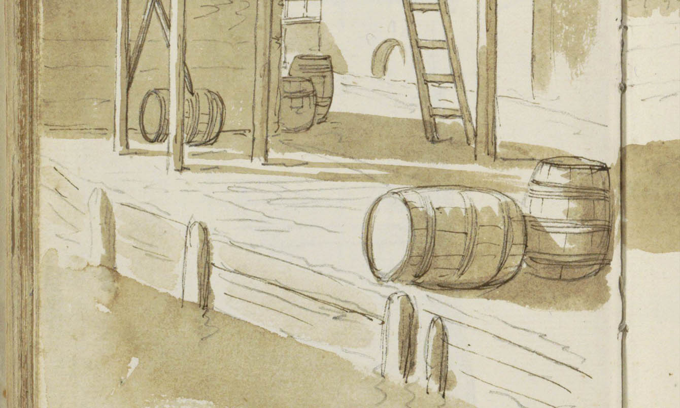 Wooden barrels at a warehouse on a quay